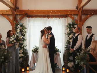 Emily and Zack kiss after the ceremony in the barn - photo by Thalia Abreu @thaliacamerist